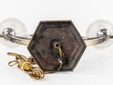 pair of brass and glass wall sconces with a brass plated base and a brass plated base with a brass plated base and a brass plated