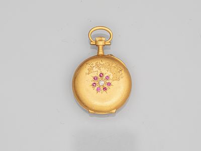 an image of a gold pocket watch with pink flowers on it