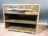 a wooden shelf with a metal handle on it