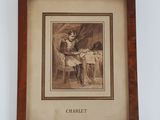 une vieille photo représentant une femme assise à une table, face à un chat