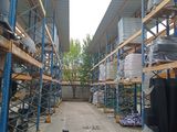 many shelves that are filled with items in a warehouse