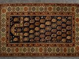 a close up of a rug on a floor with a gray background