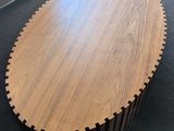 the table is made of wood and has a circular design on it