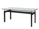 une table en verre avec des pieds noirs et un plateau en verre