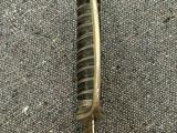a close up of a hair brush on a carpet