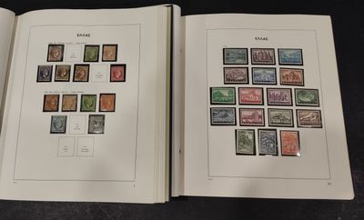 two pages of a book with stamps on them sitting on a table