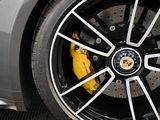a close up of a car ' s wheel with a yellow brake