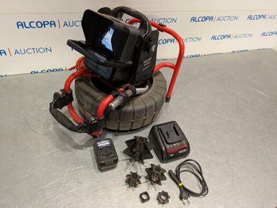 a camera and other electronics on a table