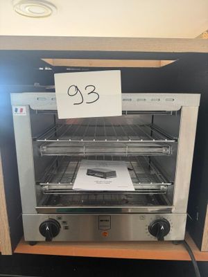 a toaster oven that has a sign on it