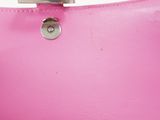 the inside of a pink purse with a metal clasp
