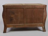 an old wooden chest sitting on top of a white floor