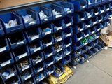 many bins of assorted items on the floor
