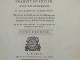 an old book with a picture of a clock on it