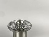 a silver lamp that is sitting on a table