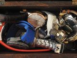 a wooden box filled with assorted watches and other items