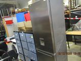 an image of a refrigerator in a warehouse with many boxes