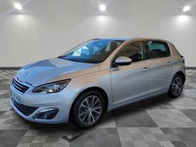 a silver car is parked in a room with a checkered floor