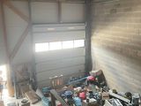 a garage with a lot of clutter and tools in it