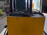 a close up of a yellow box sitting on top of a wooden pallet