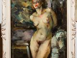an oil painting of a nude woman in a white frame on a table