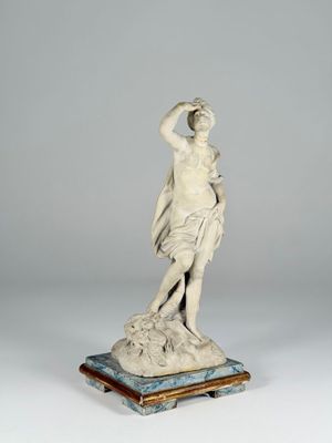 an image of a statue of a woman holding a flower