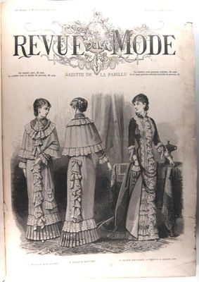 an old fashion book with a picture of three women in dresses