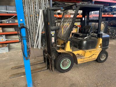 a forklift that is parked in a warehouse