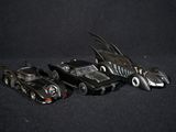 three toy cars that are sitting next to each other