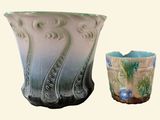 two vases sitting next to each other on a table