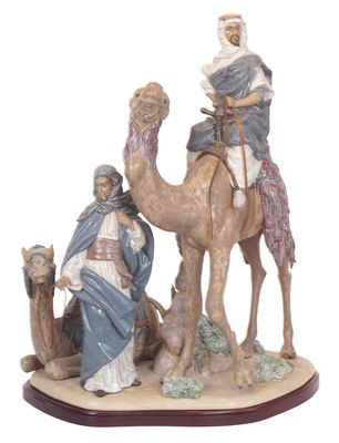 figurine of the three wise men on camels with jesus and mary