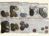 a lot of coins in the bags on the table