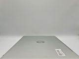 an open laptop computer sitting on top of a white table
