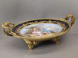 an ornately decorated tray with a painting on it