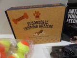 a box of tennis balls and a package of dog toys