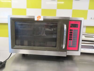 a microwave that is sitting on a counter in a kitchen