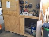 a cabinet that has a bunch of tools inside of it