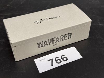 a box that is sitting on a table with a tag on it