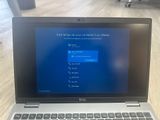 dell laptop computer with windows 10 screen and keyboard