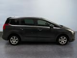 a picture of a black minivan parked in a garage
