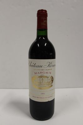 a bottle of wine that is sitting on a table