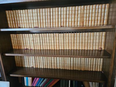 a book shelf that has many books on it
