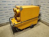 une image représentant une machine jaune posée sur un sol en béton