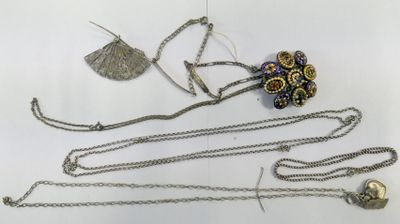 a lot of jewelry that is laying out on the table