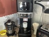 a coffee maker and blender on a counter in a kitchen