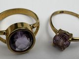 three gold rings with amethorate and amethorate stones