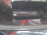 a close up of a car ' s rear view mirror with a sticker on it