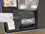 a keyboard, mouse, and other items in a case