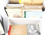 several books are stacked on top of each other on a table