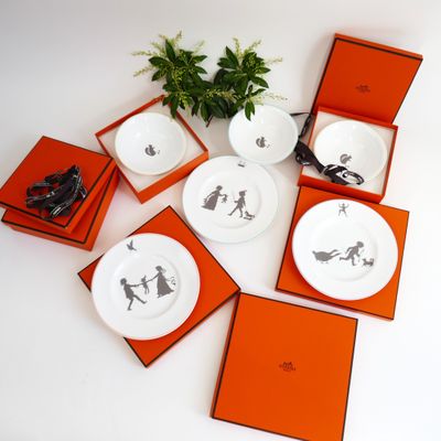four plates with different designs on them on a table