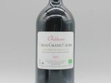 bouteille de vin rouge avec une étiquette du Château Merix Grand Faure